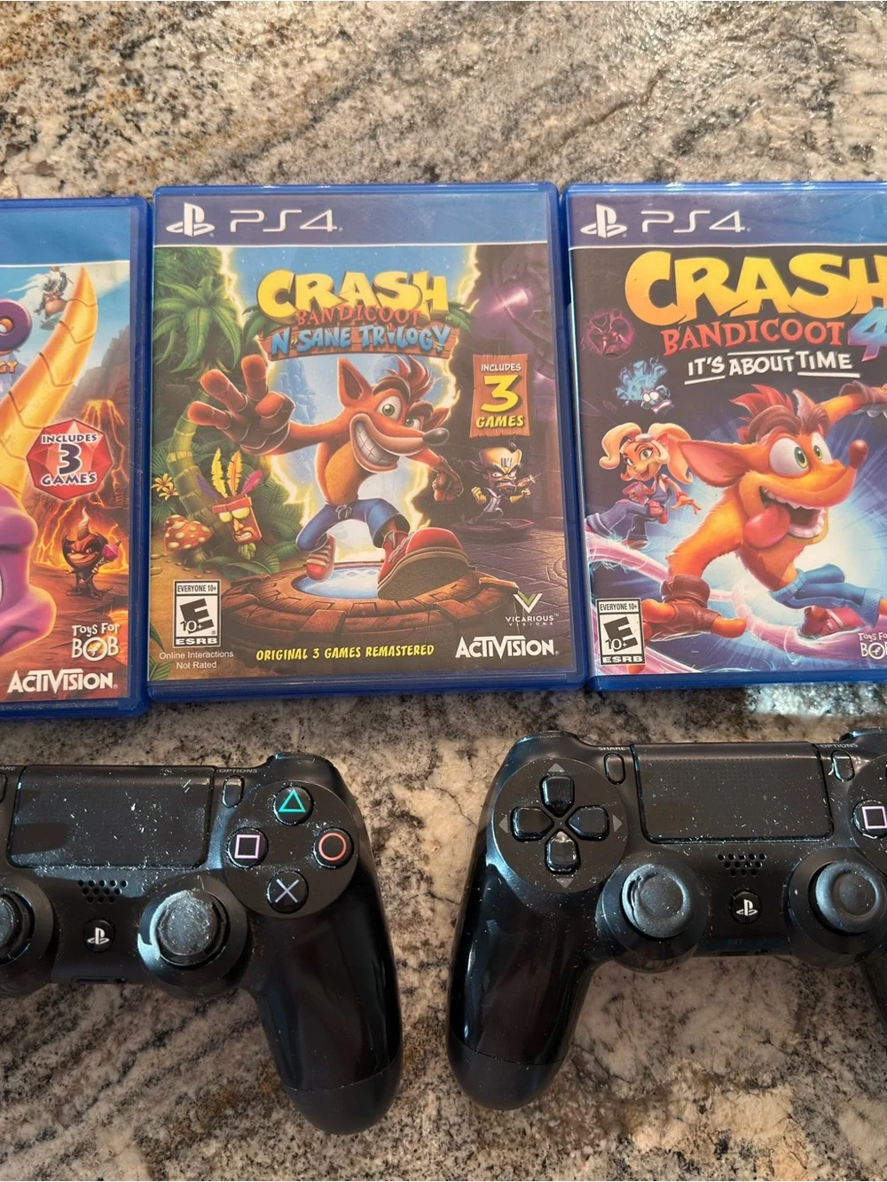 Sony PlayStation 4 Black Console with 2 PS4 Controllers and Spyro & Crash Games